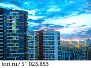 The urban landscape of a new neighborhood in MINSK with high-rise buildings and a large building with the inscription "AviaMALL" on it. Belarus. Minsk. 05.08.2025. Редакционное фото, фотограф Ярославский Максим / Фотобанк Лори