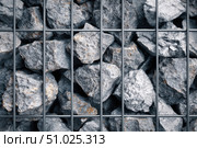 Gabion wall. Abstract architectural background of rough retaining wall made from rocks in steel cage gabion baskets. Retaining wall gabion basket, caged stones textured backdrop. Modern granite rubble. Стоковое AI-изображение, AI-художник Марина Демидюк / Фотобанк Лори