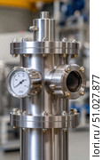 Industrial pipeline system featuring pressure gauge and sight glass. Стоковое AI-изображение, AI-художник Юрий Поздников / Фотобанк Лори