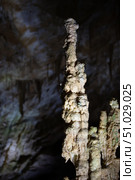 The cave is karst, amazing view of stalactites and stalagnites illuminated by bright light, a beautiful natural attraction in a tourist place. Стоковое фото, фотограф Лазаренко Светлана / Фотобанк Лори