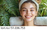 A cheerful young woman enjoys her time in a tranquil space surrounded by vibrant greenery while smiling brightly. Стоковое AI-видео, аниматор Данила Большаков / Фотобанк Лори