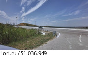Scenic view of highway with blue sky and wispy clouds in rural area. Стоковое видео, видеограф Наталия Попова / Фотобанк Лори