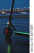 Dynamic Night Ride: A Close-Up of a Modern Electric Scooter Illuminated by Urban Lights, Showcasing Innovative Transportation in Action on a Rainy Evening. Стоковое AI-видео, аниматор Владимир Федоров / Фотобанк Лори