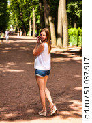 Glancing Back, Lady Strolls a Sunny Path in Summer Garden, Saint Petersburg. Стоковое фото, фотограф Aleksandr Golubev / Фотобанк Лори