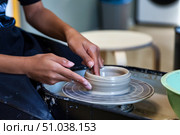 Crafting Clay With Focused Hands in a Pottery Workshop During the Daytime. Стоковое фото, фотограф Aleksandr Golubev / Фотобанк Лори