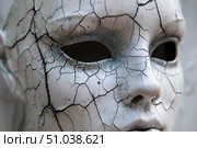 White cracked mask representing aging and decaying beauty. Стоковое AI-изображение, AI-художник Иван Рябоконь / Фотобанк Лори
