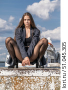 Full length portrait of a young brunette in a formal jacket and black tights. Стоковое фото, фотограф Андрей Аркуша / Фотобанк Лори