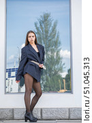 Full length portrait of a young brunette in a formal jacket and black tights. Стоковое фото, фотограф Андрей Аркуша / Фотобанк Лори
