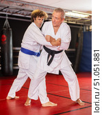 Karate with male athletes practicing, training and sparring in fight class. Стоковое фото, фотограф Яков Филимонов / Фотобанк Лори