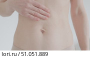 Hands stretch belly skin over navel to show sagging. Стоковое видео, видеограф Olesia Kondrateva / Фотобанк Лори