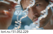 Focused analysis of DNA strands by a researcher in a laboratory setting during a bright day. Стоковое AI-видео, аниматор Сергей Толмачёв / Фотобанк Лори