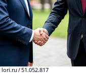 Деловое рукопожатие. Два бизнесмена заключили сделку. Стоковое AI-изображение, AI-художник Руслан Лесков / Фотобанк Лори