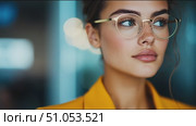 Young woman with blue eyes and glasses poses confidently in a stylish yellow outfit while captured in a modern setting. Стоковое AI-видео, аниматор Сергей Толмачёв / Фотобанк Лори