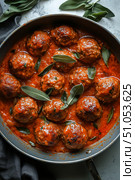 Hearty Meatballs Simmer in a Rich Tomato Sauce With Fresh Herbs for a Delicious Meal. Стоковое AI-изображение, AI-художник Юлия Гапеенко / Фотобанк Лори