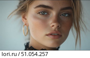 Captivating close-up of a young woman showcasing natural beauty in a minimalist setting. Стоковое AI-видео, аниматор Сергей Толмачёв / Фотобанк Лори