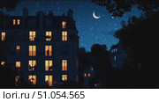 Magical night in a city neighborhood with glowing windows and a crescent moon above. Стоковое AI-видео, аниматор Сергей Толмачёв / Фотобанк Лори