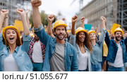 Diverse young group celebrating at outdoor construction site. Стоковое AI-изображение, AI-художник Olga Didraga / Фотобанк Лори