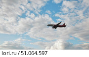 Passenger plane landing at the airport in cloudy sky. Стоковое видео, видеограф Mikhail Davidovich / Фотобанк Лори