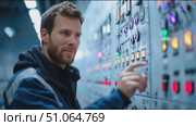 Operator manages control panel at industrial facility during nighttime operations. Стоковое AI-видео, аниматор Сергей Толмачёв / Фотобанк Лори