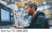 Skilled technician operates modern machinery in a bustling workshop environment during daylight hours. Стоковое AI-видео, аниматор Сергей Толмачёв / Фотобанк Лори