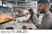 Focused man and woman as they explore the depths of the digital realm, united by their shared passion for technology and collaboration. Стоковое AI-видео, аниматор Данила Большаков / Фотобанк Лори