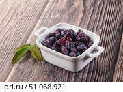 Sweet juicy ripe honeysuckle berries. Стоковое фото, фотограф Андрей Старостин / Фотобанк Лори