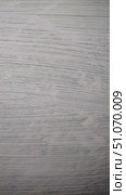 Texture of wooden surface with etching of a tech company logo and design details displayed prominently in a modern setting. Стоковое фото, фотограф Александра Рублева / Фотобанк Лори
