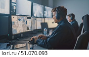 Security personnel working diligently in a high-tech control room, analyzing real-time data on multiple screens during a night shift. Стоковое AI-видео, аниматор Данила Большаков / Фотобанк Лори