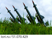 Four S-125 SAM missiles lined up in a row on a field covered with grass. Belarus. Stalin's Line Park. 10.08.25. Редакционное фото, фотограф Ярославский Максим / Фотобанк Лори