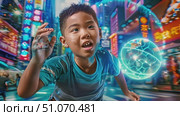 A young boy plays a virtual reality game in a bustling neon city at night. Hes wearing a blue shirt and has a determined look on his face. Стоковое AI-видео, аниматор Данила Большаков / Фотобанк Лори