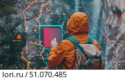 A hiker uses a high-tech, interactive map to navigate through the wilderness. Стоковое AI-видео, аниматор Данила Большаков / Фотобанк Лори