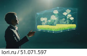 A young student showcases an interactive garden concept using augmented reality technology at a school science fair. Стоковое AI-видео, аниматор Данила Большаков / Фотобанк Лори