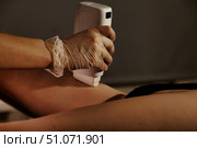 Waxing Session In A Spa With Protective Gloves On Hands. Стоковое фото, фотограф Aleksandr Golubev / Фотобанк Лори
