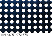 Black plastic surface with regular round holes. Стоковое фото, фотограф Юрий Бизгаймер / Фотобанк Лори