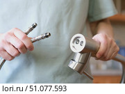 A close-up of a mixer with flexible hoses for cold and hot water installed. Стоковое фото, фотограф Ветерцовская Галина Валериевна / Фотобанк Лори