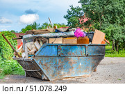 Overflowing Garbage Container with Furniture and Debris. Стоковое фото, фотограф Дмитрий Брусков / Фотобанк Лори