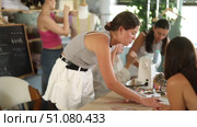 Group of happy attendees of dressmaking courses sewing, drawing with curves and working with mannequin. Стоковое видео, видеограф Яков Филимонов / Фотобанк Лори