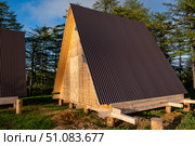 Construction of a wooden residential camping in the forest in the fresh air for tourism. Soft focus. Стоковое фото, фотограф lyudmila Soloveva / Фотобанк Лори