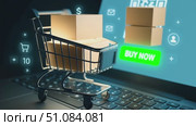 A shopping cart on a laptop keyboard with a digital buy now button and QR code. Represents online shopping and e-commerce concepts. Стоковое AI-видео, аниматор Nart / Фотобанк Лори