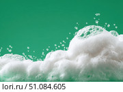 Beauty Product Foam Soap. Abstract background white soapy foam flowing texture. Shampoo foam with bubbles. Bubble surface isolated on a green color. Chroma key. Suds. Facial cleanser. Froth Pattern. Стоковое AI-изображение, AI-художник Марина Демидюк / Фотобанк Лори