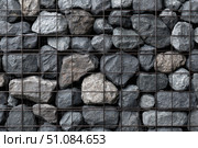 Gabion wall. Abstract architectural background of rough retaining wall made from rocks in steel cage gabion baskets. Retaining wall gabion basket, caged stones textured backdrop. Modern granite rubble. Стоковое AI-изображение, AI-художник Марина Демидюк / Фотобанк Лори