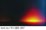 Old film texture with a rainbow lens flare effect. The image features a gradient of colors transitioning from orange to red and blue, creating a vibrant visual atmosphere. Стоковое AI-видео, аниматор Nart / Фотобанк Лори