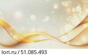 Abstract background with soft golden waves and bokeh lights. The design features smooth curves and a light color palette, creating a serene atmosphere. Стоковое AI-видео, аниматор Nart / Фотобанк Лори