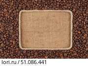 Frame  made of rope with  coffee beans  lying on sacking. Стоковое фото, фотограф Александр Собко / Фотобанк Лори