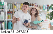 Couple view trademark sign on label, pick eco friendly chemical cleaner spay. Стоковое видео, видеограф Яков Филимонов / Фотобанк Лори