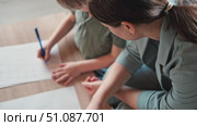 Mom education son writing. Kids learn and study in home school. Mommy female helping teaching little boy support studying, learning homework. Child care teach study. Knowledge day. Children schooling. Стоковое видео, видеограф Марина Демидюк / Фотобанк Лори