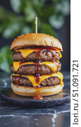 Delicious Triple-Decker Burger with Melted Cheese and Tangy Sauce, Perfectly Garnished on a Stone Plate Surrounded by Lush Greenery. Стоковое AI-видео, аниматор Владимир Федоров / Фотобанк Лори