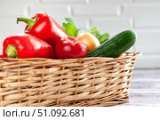Various vegetables in a wicker basket. Food. Tomatoes, onions, peppers, cucumbers. Стоковое фото, фотограф Анастасия  Гудантова / Фотобанк Лори