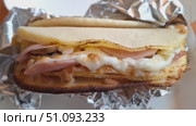 Pete with omelet, bacon and cheese, in foil, Стоковое видео, видеограф Zakharova Natasha / Фотобанк Лори