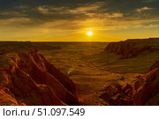 Bayanzag flaming cliffs at sunset in Mongolia. Стоковое фото, фотограф Михаил Коханчиков / Фотобанк Лори